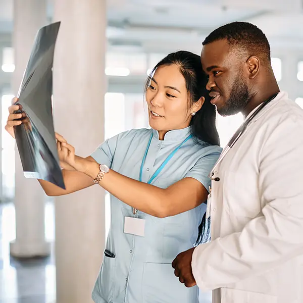 Doctor explaining xray to student